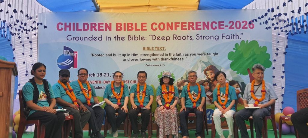 CHILDREN BIBLE CONFERENCE INSPIRES YOUNG HEARTS ---Gobindopur SDA Church, NBM | March 18–21, 2026 The Children Bible Conference was successfully held from March 17–21, 2026, at Gobindopur SDA Church, NBM, bringing together children, leaders, and special guests for a spiritually uplifting experience. The program was centered on the theme: “Grounded in the Bible: Deep Roots, Strong Faith”, based on Colossians 2:7, encouraging participants to be rooted in Christ, strengthened in faith, and filled with gratitude. The conference was led by Young Sook Chun, Children Ministries Director of NSD, and Soo Kyung Kim, Children Ministries Director of BAUM. Their dedicated leadership ensured a meaningful and well-organized program. The event was further honored by the presence of BAUM President Pr. Won Sang Kim and BAUM Executive Secretary Pr. Benjamin Mrong, along with North Bangladesh Mission Officers, whose participation added great encouragement and support to the program. Throughout the conference, children actively participated in Bible learning sessions, songs, and interactive activities designed to strengthen their spiritual foundation. Special guests were warmly welcomed with traditional floral garlands, reflecting appreciation and cultural hospitality. -John Roy, BAUM Education and Communication Director-