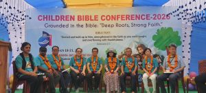 CHILDREN BIBLE CONFERENCE INSPIRES YOUNG HEARTS ---Gobindopur SDA Church, NBM | March 18–21, 2026 The Children Bible Conference was successfully held from March 17–21, 2026, at Gobindopur SDA Church, NBM, bringing together children, leaders, and special guests for a spiritually uplifting experience. The program was centered on the theme: “Grounded in the Bible: Deep Roots, Strong Faith”, based on Colossians 2:7, encouraging participants to be rooted in Christ, strengthened in faith, and filled with gratitude. The conference was led by Young Sook Chun, Children Ministries Director of NSD, and Soo Kyung Kim, Children Ministries Director of BAUM. Their dedicated leadership ensured a meaningful and well-organized program. The event was further honored by the presence of BAUM President Pr. Won Sang Kim and BAUM Executive Secretary Pr. Benjamin Mrong, along with North Bangladesh Mission Officers, whose participation added great encouragement and support to the program. Throughout the conference, children actively participated in Bible learning sessions, songs, and interactive activities designed to strengthen their spiritual foundation. Special guests were warmly welcomed with traditional floral garlands, reflecting appreciation and cultural hospitality. -John Roy, BAUM Education and Communication Director-